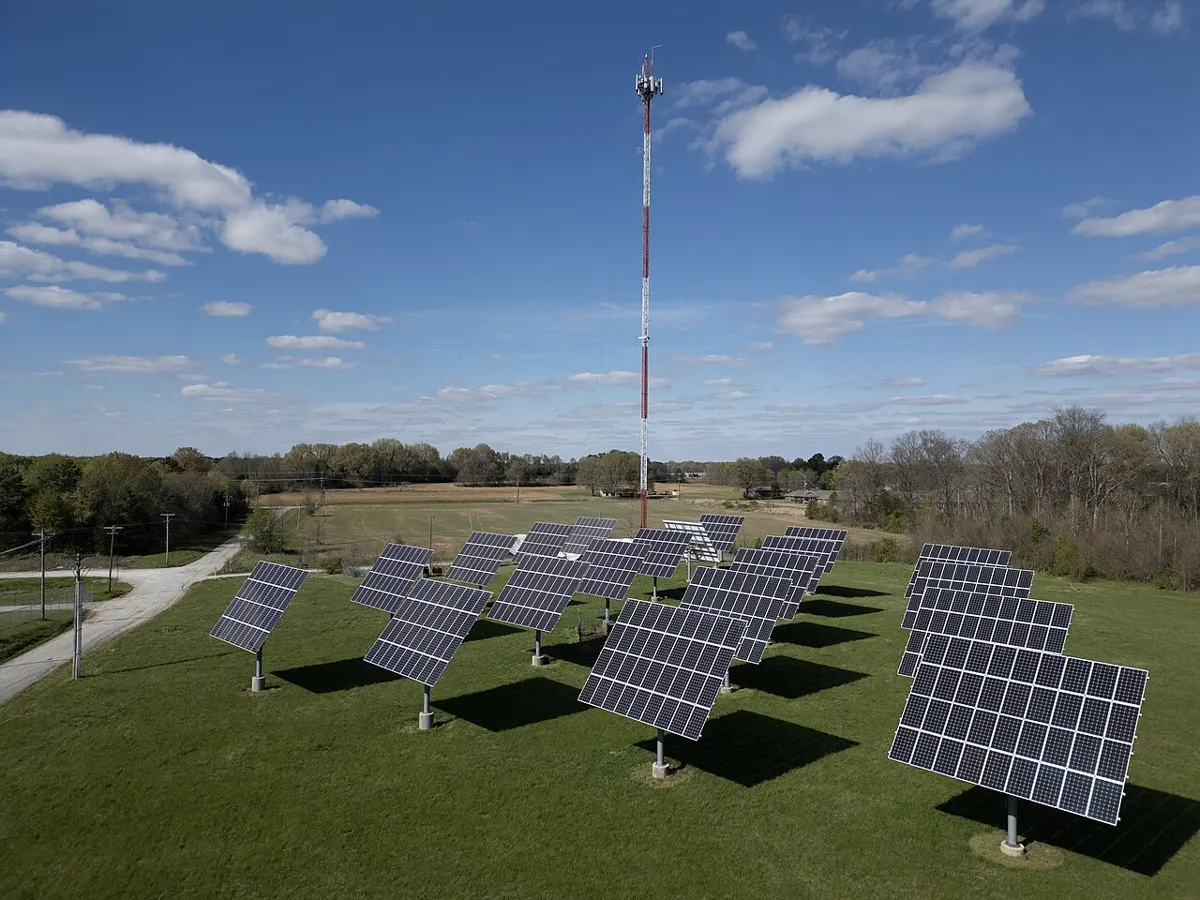Water tower in Humboldt, Tennessee, with a solar array in the background
